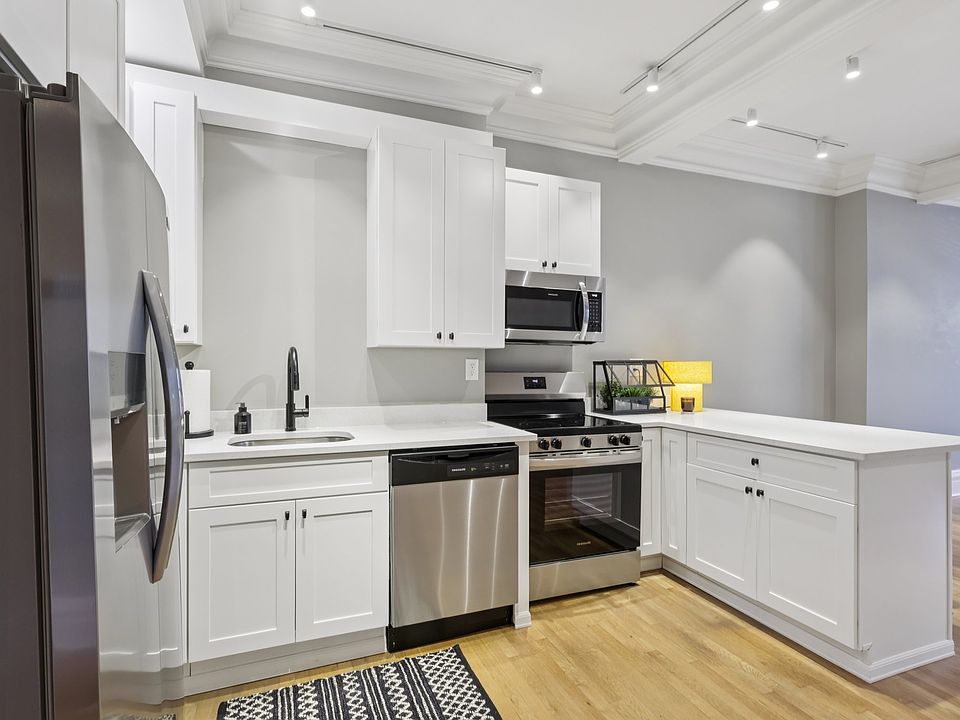 Brand new kitchen with stainless steel appliances.