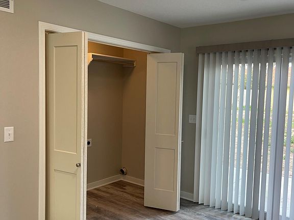 Laundry / storage area with washer and dryer hookups by Dining area