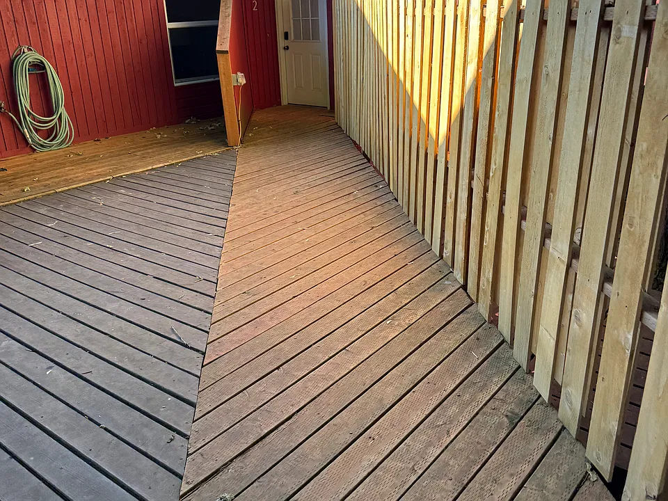 Walkway to home. Private front deck behind fence