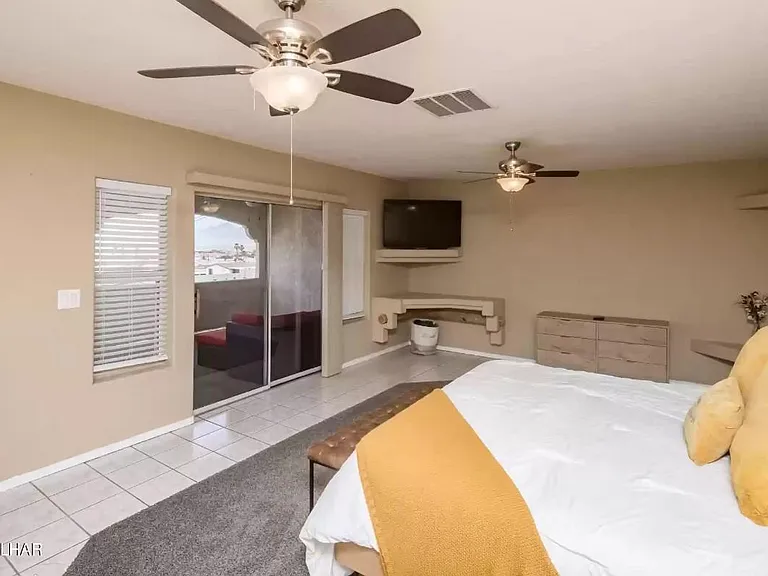 King bedroom with balcony access