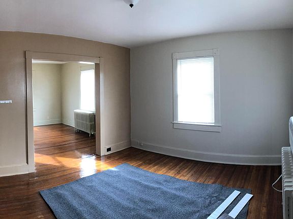 Dining room open to living room. Commercial window A/C unit provided for tenant's use.