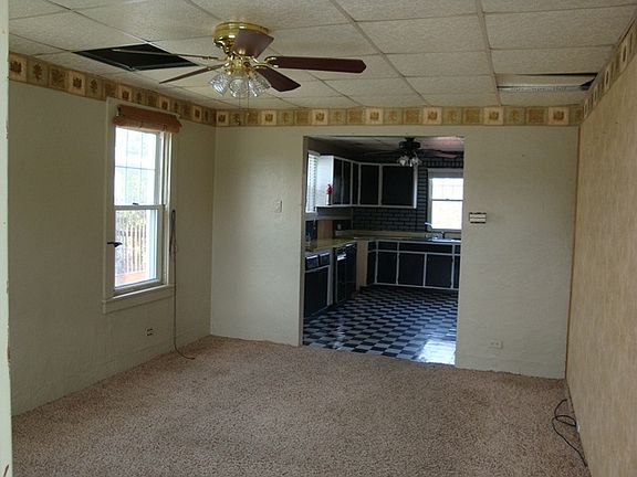 Newer windows in living room that opens to kitchen