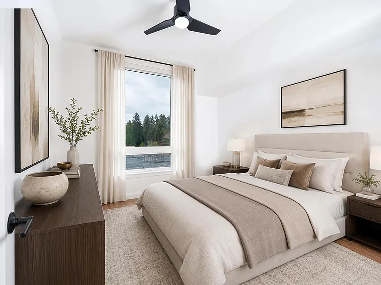 Primary bedroom with soft natural light, tailored finishes, and a calm layout designed for rest and a comfortable daily rhythm.