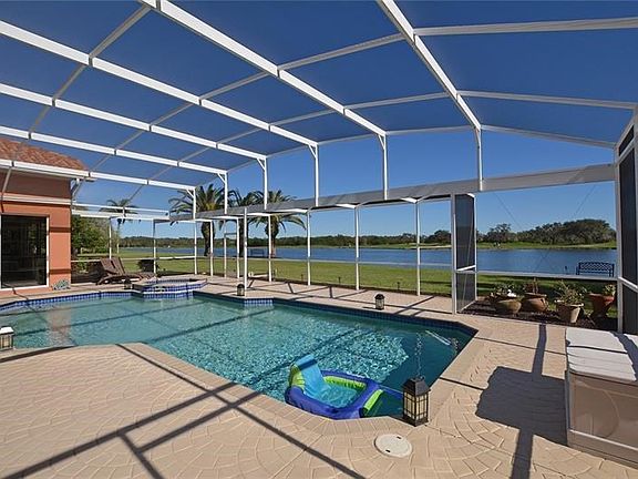 Nearly 1/2 acre private lot w/pool, spa & spacious screened lanai.