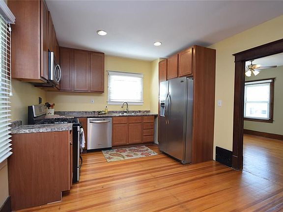 Kitchen features newer stainless steel appliances and 42 " cabinets