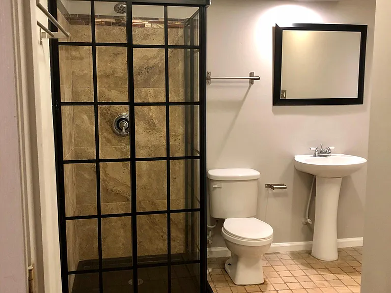 Ensuite bathroom with built in bluetooth speaker access