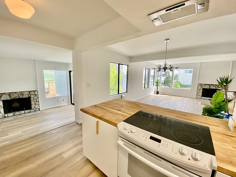 Beautiful open floor plan with new flooring, paint, and two fireplaces!