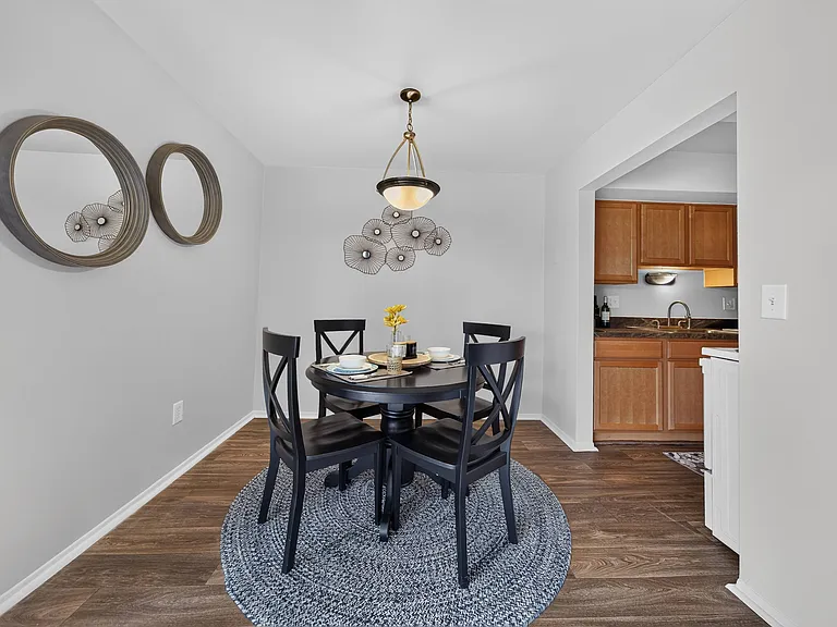 Spacious dining room area at Drawbridge Apartments in Harrison Township, MI.