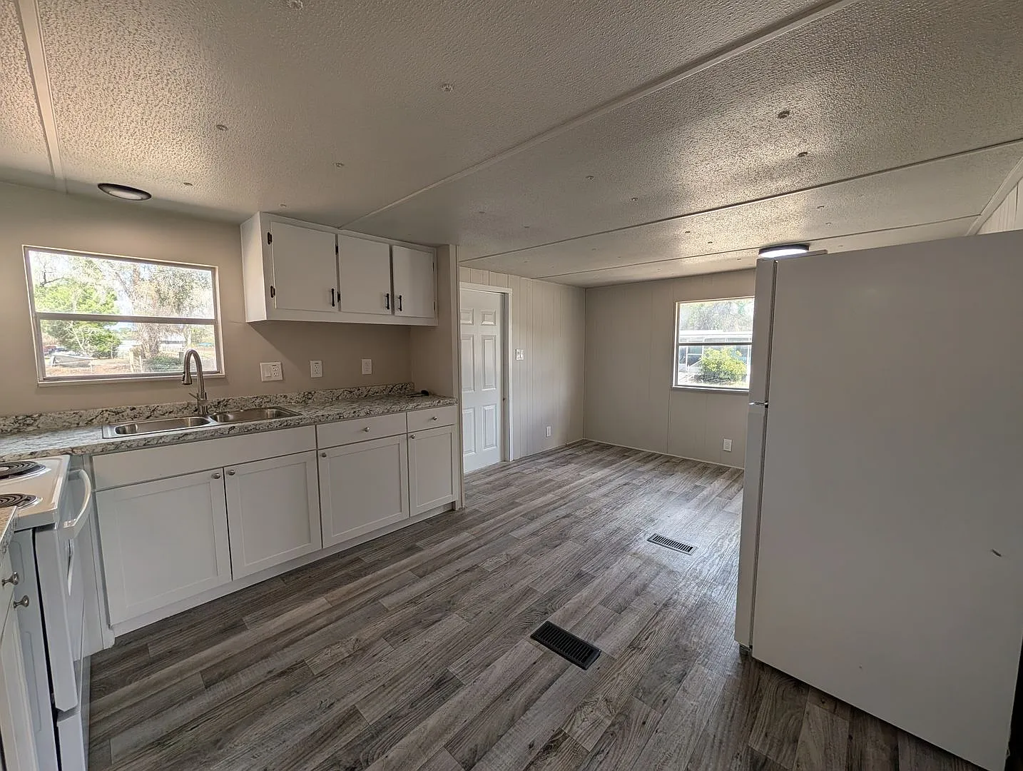 Beautifully renovated 3 bedroom, 1.5 bath home on a spacious .65-acre lot with a fenced backyard ... — Photo 1