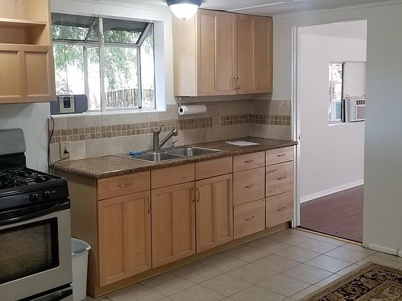 The kitchen is in the main living area. The Pictured door leads to the full bedroom.