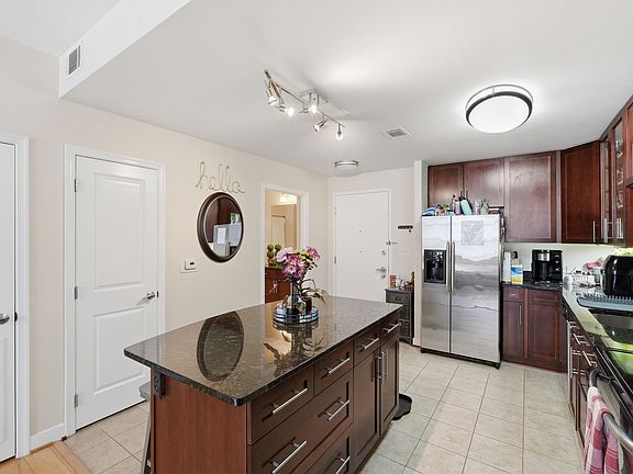Kitchen with abundant cabinet storage, granite countertops, and an open-concept layout.