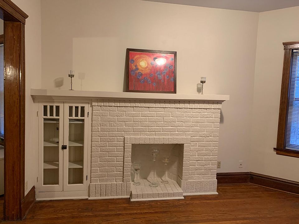 Living room -as you walk in from staircase. Faux fire place