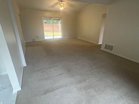 Den. Opens to patio.