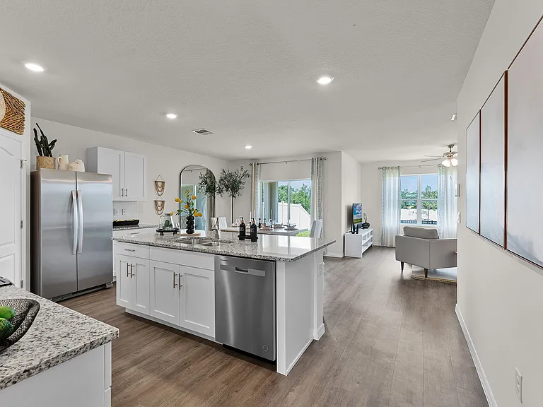 Spacious open-concept layout with modern kitchen and living area.