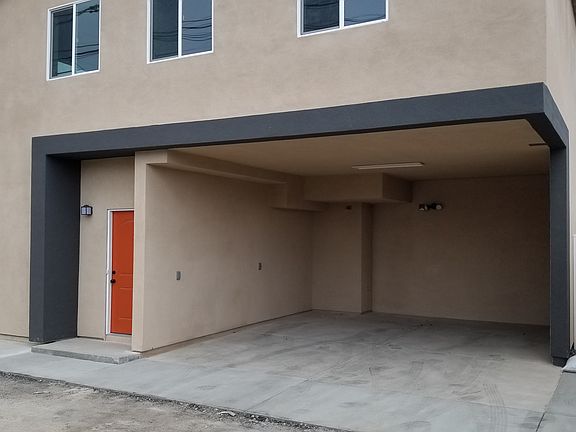 Back door and parking along Alley