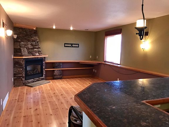 Family Room with custom fireplace and wet bar