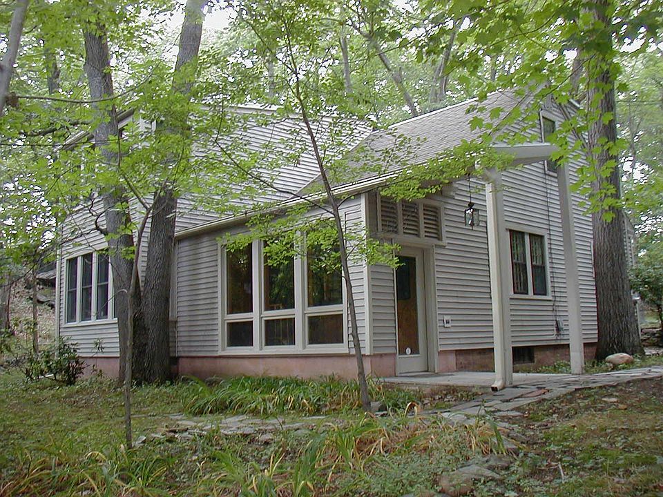 side / rear entrance to sun porch and house