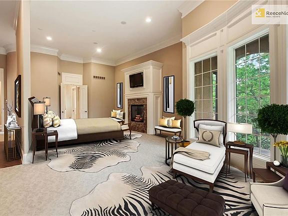 Virtually staged master bedroom includes two entrances, a spa-like like master bathroom, and a private porch.
