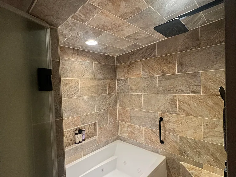 Master bath is a wet room with an XL jetted tub and steam shower.