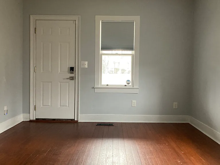 View of front door and living room.