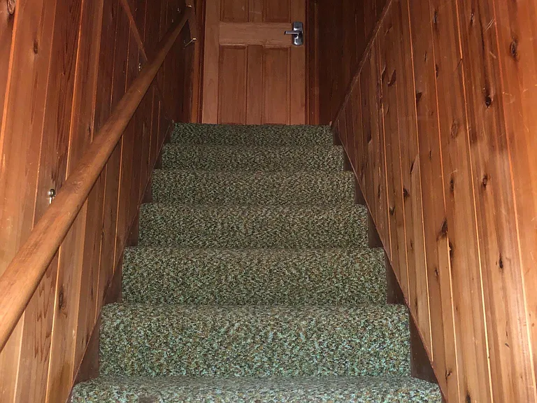 the outside door leads to these stairs and a keyless entry