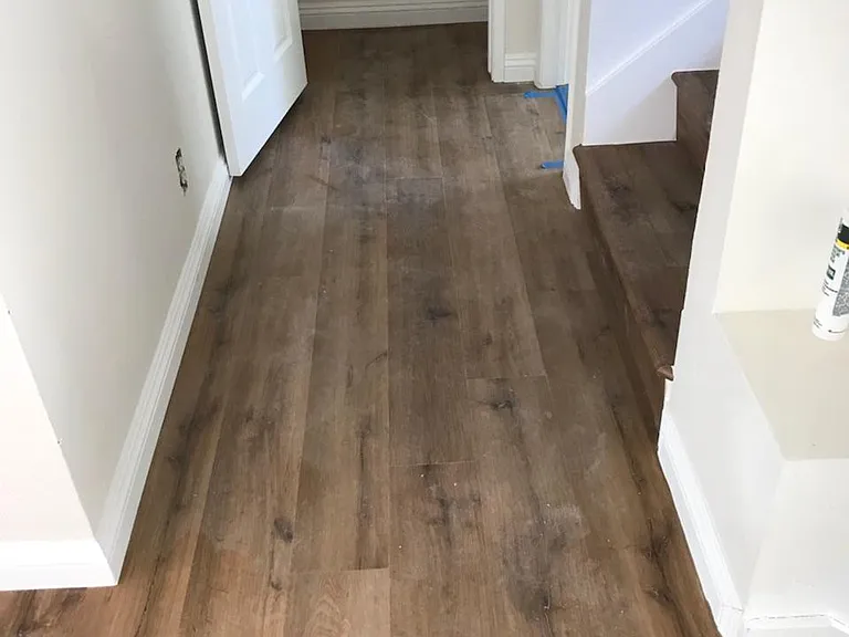 Main level hallway leads to upstairs