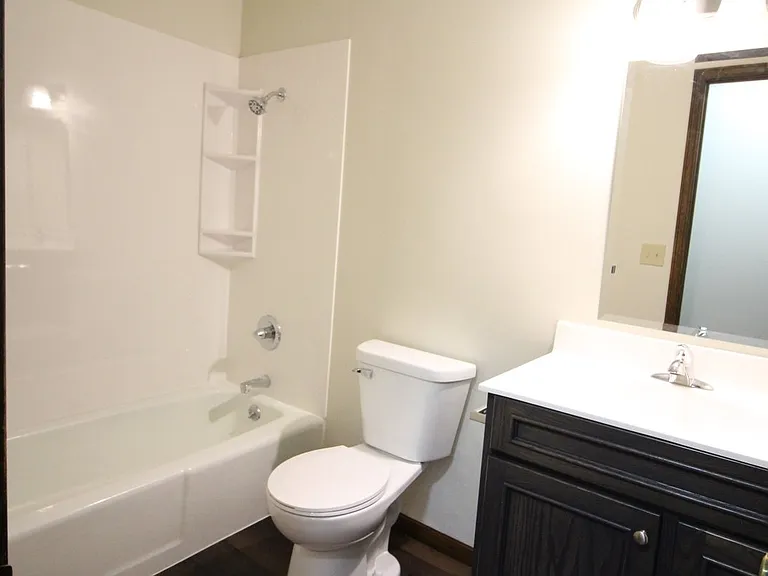 Hall bath updated with new counter top and lighting. For public access and Bedrooms 2 & 3.