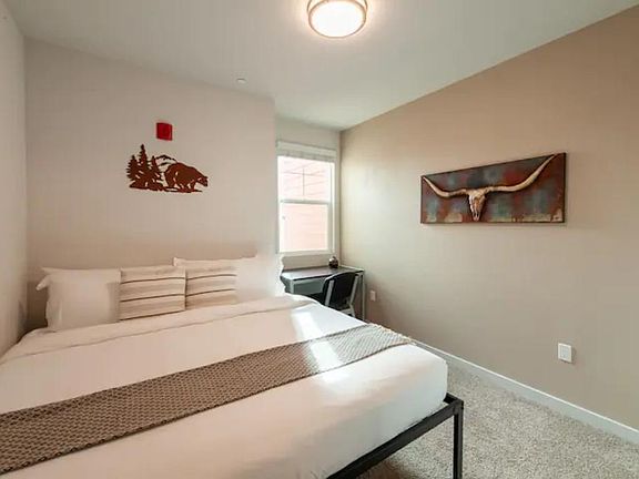 Catch some 'zzz's! Enjoy your own private bedroom equipped with a king-size bed and desk/chair.