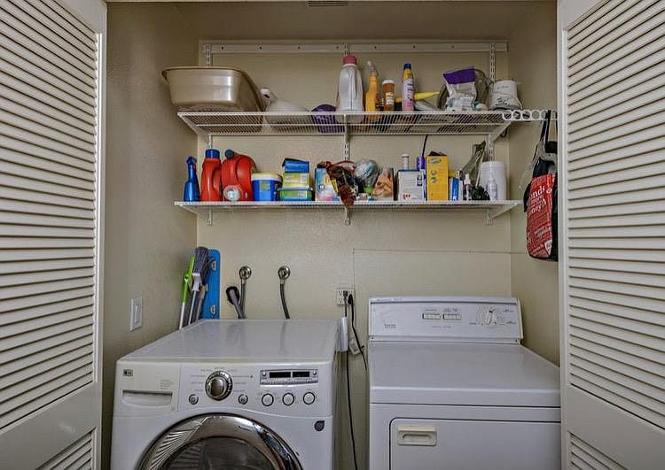 Washer & Dryer on living room floor.