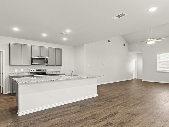 Dining to kitchen and family room