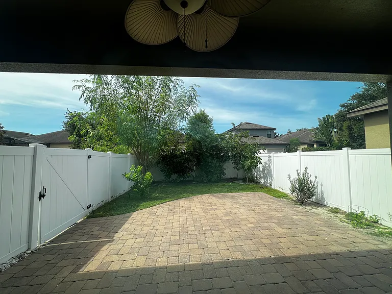 ENJOY FLORIDA'S WEATHER ON YOUR HAMOCK CHAIRS UNER THIS PAVED AND COVERED LANAI, WHILE ENJOYING THE PEACEFUL AND SERENE, LUSH FRUIT TREES GARDENER'S PARADISE.