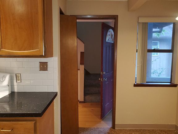 On the other side, the kitchen faces the front door. There's a pantry on the left and breakfast nook on the right.