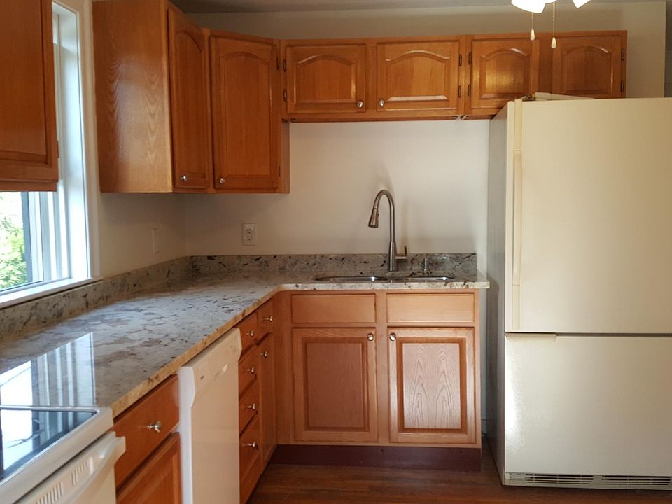 Granite counter with dishwasher microwave & sink.