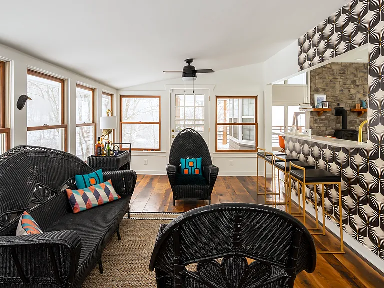Bright sunroom with a full bathroom -- perfect for showering when you come in from the lake or river