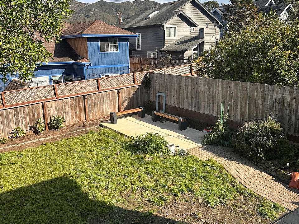 Spacious backyard with updated patio area and plenty of room for a dog.