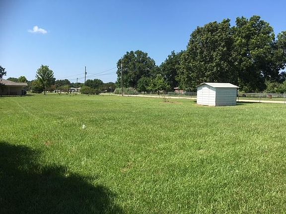 Fenced Backyard with Storage Shed
