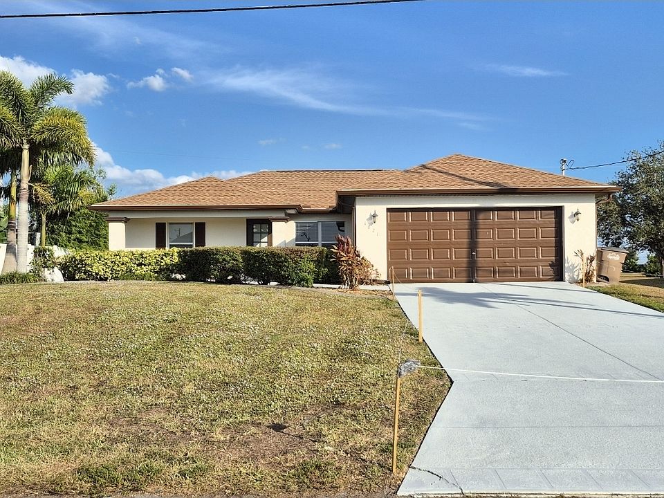 Front of house with new painted driveway
