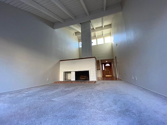 Fireplace divides the living room and dining area