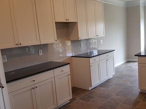 Upgraded White Cabinets with Dark Granite
