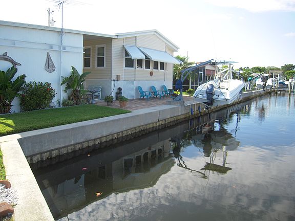 REAR WITH VIEW OF SEAWALL