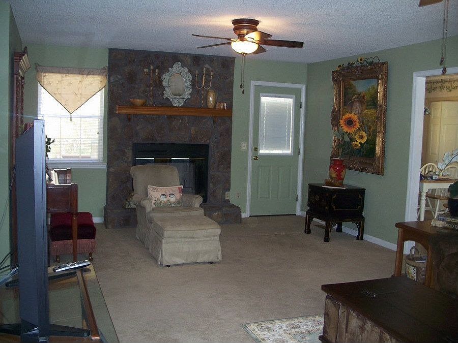 Living room w/ woodburning fireplace