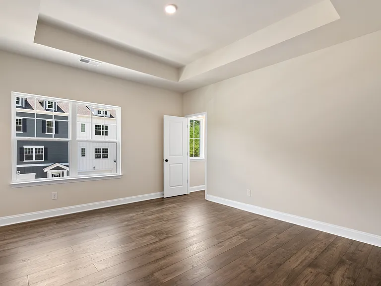 Primary bedroom with 2 walk-in closets