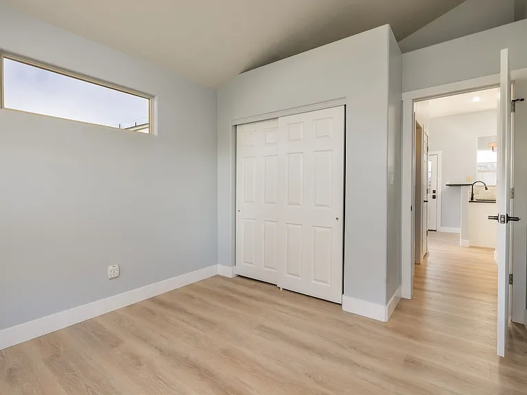Looking towards closet and kitchen