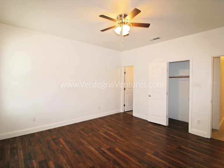 The principal bedroom includes a private exterior door with direct access to the driveway