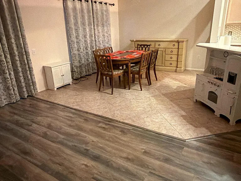 Dining Area is conveniently located next to kitchen and has large windows facing the garden. It is also conveniently located next to living room with tall ceilings and sliding doors into the screened lenai.