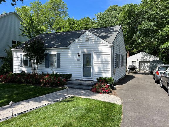 Front View with Paver Walkway and Night Lighting