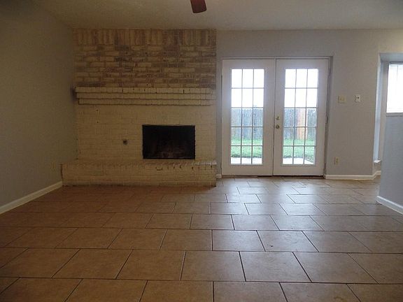 Family Room (14' x 14'). Fireplace, and notice the French double doors!
