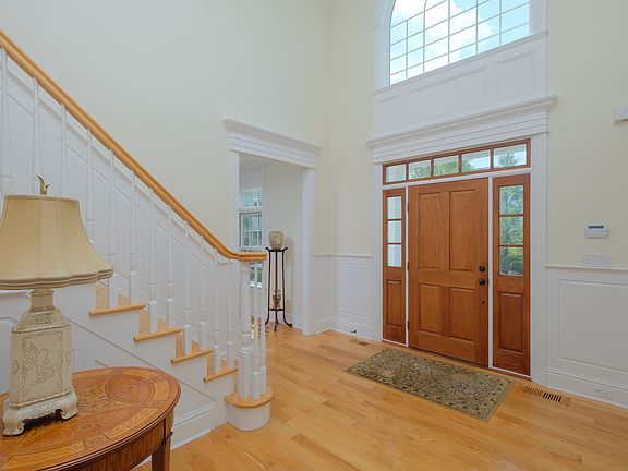 Two story entry foyer opens to a true center hall colonial