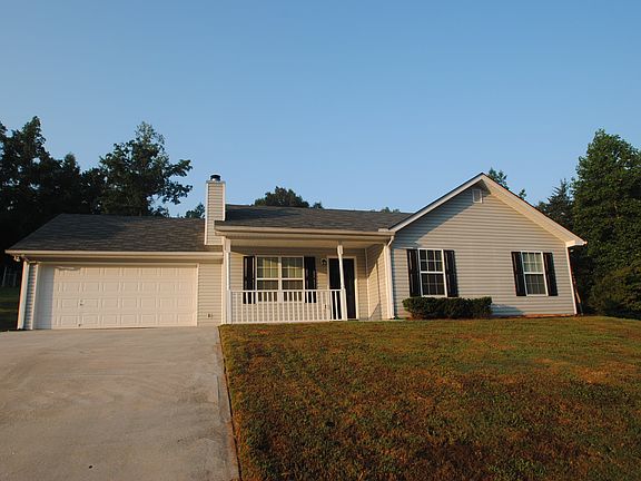 Front of the Home w/ View of the Driveway and Yard