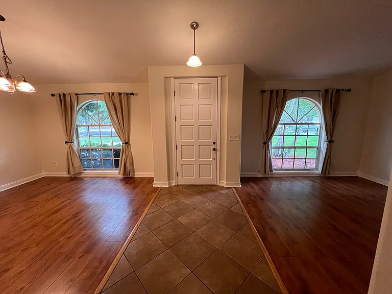 foyer separates dining room and bonus room